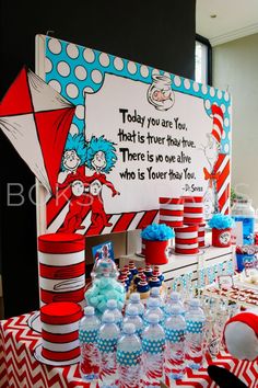 a dr seuss birthday party with red, white and blue dessert tablecloths