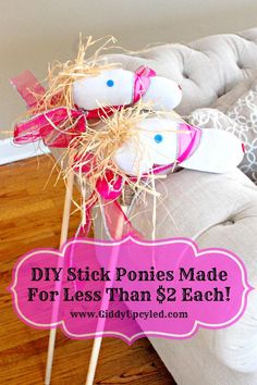 two stuffed animals sitting on top of sticks in the middle of a living room with text overlay saying diy stick ponies made for less than $ 2 each