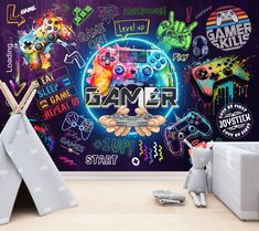 a child's room with a large wall mural featuring video games and gaming related items