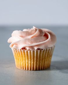 a cupcake with pink frosting on top