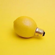 a light bulb shaped like a lemon on a yellow background