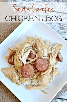 a white plate topped with chicken and rice next to a wooden table holding hotdogs