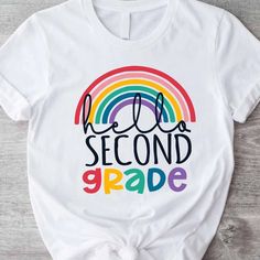 Hello Second Grade Shirt, Second Grade Teacher, 2nd Grade Discover Our Newest Collection Of Stylish And Adaptable T-Shirts (Gildan 5000), Where Fashion Meets Comfort! Available In A Wide Range Of Sizes From S To 3xl And Lively Color Choices Including Black, White, Sand, Green, Sport Grey, Red, Navy, And More, Ensuring There's Something For Everyone. Carefully Crafted With Premium Materials, Our T-Shirts Offer A Luxurious Feel And A Snug Fit That Lasts All Day. Engineered To Withstand Frequent We Teacher 2nd Grade, Second Grade Shirt, Black High Neck Top, American Flag Shorts, Second Grade Teacher, Running Shirts, Teacher Tshirts, Tie Dye T Shirts, Black White Fashion