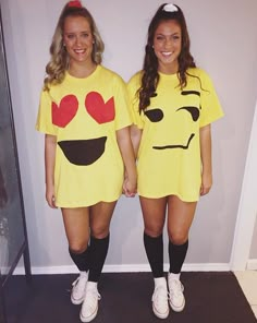 two girls dressed up as emo and smiley faces