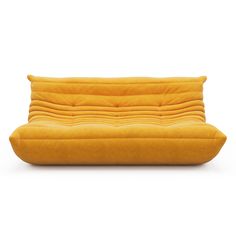 a yellow couch sitting on top of a white floor