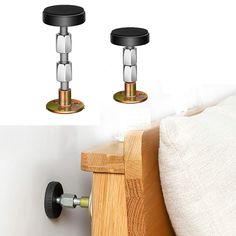 two black knobs on the side of a bed