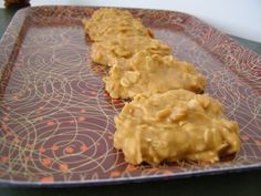 peanut butter cookies sitting on top of a metal tray