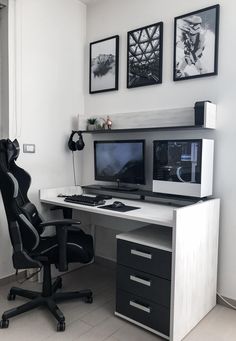 a desk with two computer monitors and a chair in front of it on top of a tile floor