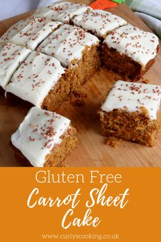 carrot sheet cake with white frosting and sprinkles cut into squares on a cutting board