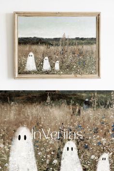 there are three white ghost statues in the grass near a framed painting on the wall