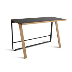 a wooden table with metal legs and a black top