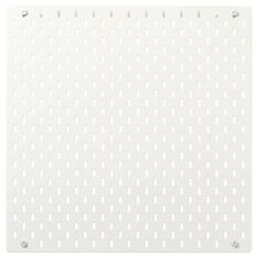 a white plastic cutting board with holes on it