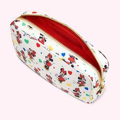 a white mickey mouse makeup bag with hearts on it