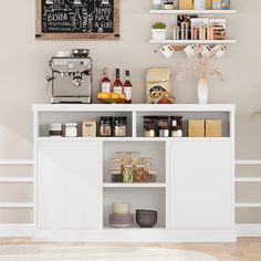 a kitchen with white cabinets and shelves filled with spices, condiments and other items