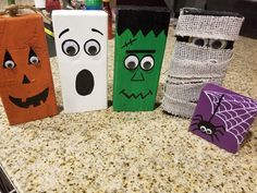 four halloween boxes sitting on top of a counter