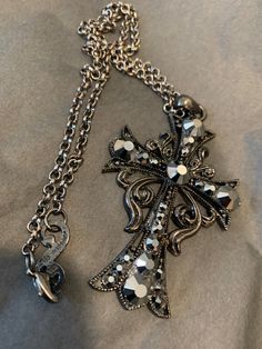 Black plated cross pendant with an adjustable chain and hematite crystals. Beautiful piece and fun to wear. Ribbon Cross, Crystals Beautiful, Goth Jewelry, Jewelry Accessories Ideas, Dope Jewelry, Jewelry Lookbook, Funky Jewelry, Gothic Jewelry, Jewelry Inspo