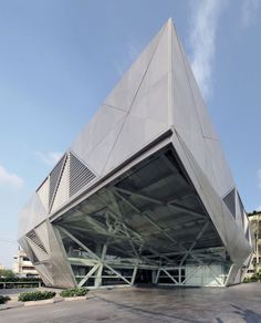 a large building with a triangular design on the side