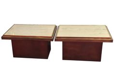 a pair of end tables made out of wood and marble in the style of art deco