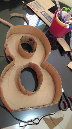 the cardboard number eight is cut out and ready to be made into a craft project