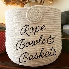 rope bowls and baskets are sitting on a table