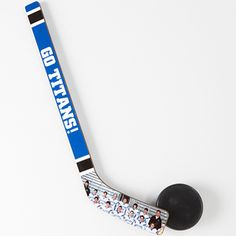 an ice hockey stick with the name bob stark on it and two black balls sitting next to it