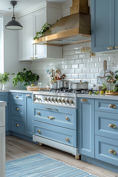 a kitchen with blue cabinets and white counter tops