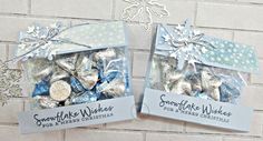 two packages of snowflake wishes for the winter holidays are shown in front of a brick wall