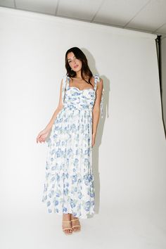 this effortless tie strap blue floral maxi dress puts all other summer outfit ideas to shame. featuring a timeless floral print + a romantic sweetheart neckline, it’s the perfect summer dress for garden parties + date nights. white + blue floral // maxi length, sweetheart neckline, adjustable tie straps, back zipper closure, smocked in back, sewn in cups, fully lined paired with our parker double strap heels // free people model is 5'8" + wearing a small measurements are approximate + taken whil Free People Models, People Model, Blue Floral Maxi Dress, Floral Dress Formal, Desi Wedding Decor, Summer Outfit Ideas, Floral Dresses Long, Floral Fit, Desi Wedding