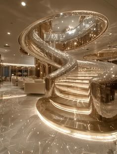 a spiral staircase in the middle of a lobby