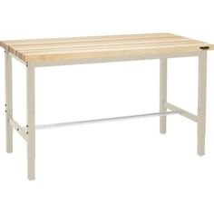 a wooden table sitting on top of a white floor