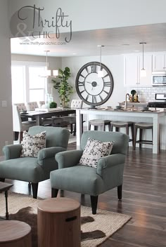 a living room filled with furniture and a large clock on the wall