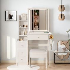 a white desk with a mirror and stool