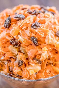 carrot salad with raisins in a glass bowl