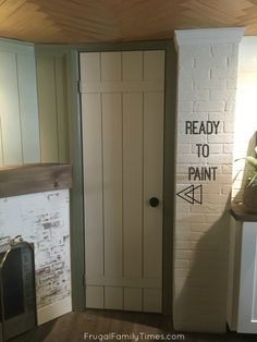 the door to the kitchen is painted white and says ready to paint with arrows on it