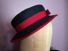 This handmade hat can work for multiple eras. Wear it tilted for the 1930s or 1940s, or wear it straight across for a turn of the century look. This hat is designed to sit at the top of the head and will fit most head sizes. As such, it may need to be secured with a hat pin. Edwardian Hats, Edwardian Hat, Sailor Hat, Orchid Purple, Hat Pin, Red Felt, Charcoal Black, Green Ribbon, Handmade Hat