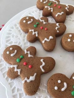 a white plate topped with cookies covered in icing