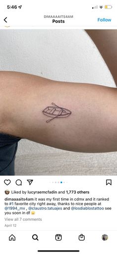 a person with a small tattoo on their arm