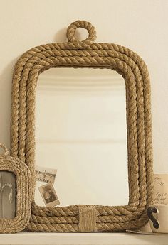 there is a mirror and rope on the shelf