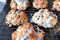 several blueberry muffins cooling on a wire rack