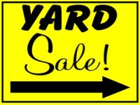 a yard sale sign with an arrow pointing to the right