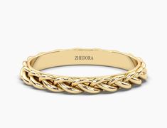 a gold braided ring with the name zeboba engraved on it's side