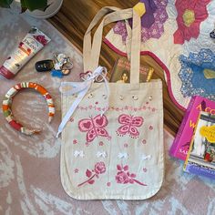 Cutie pink themed tote bag Handpainted by me :) fabric paint! 3D tiny pink roses and white bows! Used strong fabric glue to apply but refrain from washing as much as possible/hand wash gently. White adjustable bow on handbag that has a pink silver keychain and tiny white bunny charm on it!! ️🫖 Super strong and thick canvas material with six pockets inside!! And LOTS of space, could fit any laptop!! Handmade Pink Canvas Bag For Daily Use, Pink Handmade Canvas Bag For Daily Use, Daily Use Pink Hand Painted Bag, Paint 3d, Pink Tote Bag, Silver Keychain, Pink Tote Bags, White Bunny, Fabric Glue