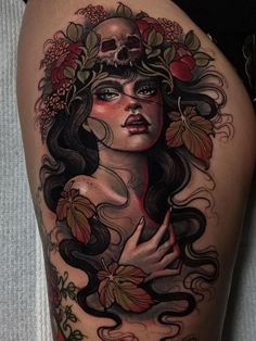 a woman with flowers and skulls on her thigh