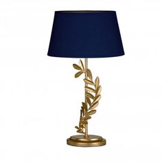 a lamp that has a blue shade on it and gold leaf decorations around the base