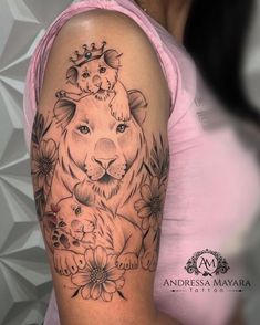 a woman's arm with a tiger and flowers tattoo on the left side of her body