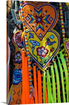 an assortment of colorful beaded and tasseled items on display in a market