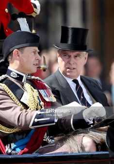 the queen and prince are riding in a horse drawn carriage