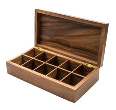 an open wooden box with six compartments on the inside and one drawer in the outside