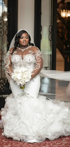 a woman in a wedding dress holding a bouquet