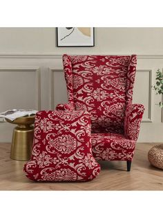 a red and white chair sitting on top of a hard wood floor